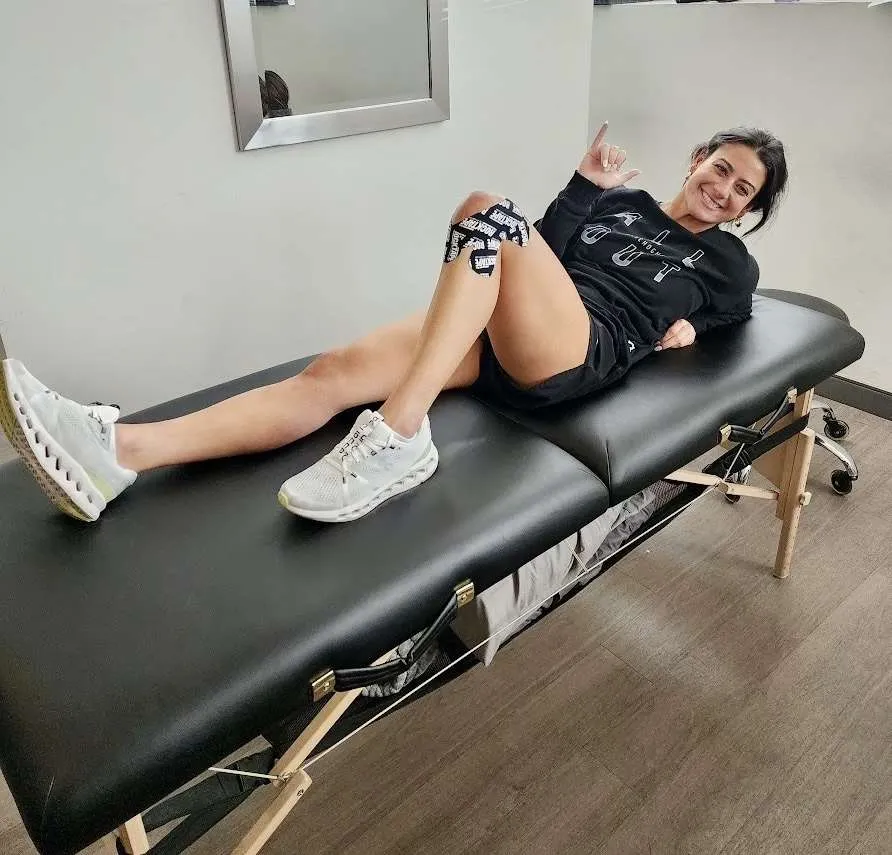 A girl getting leg pain treatments at RxWellness.
